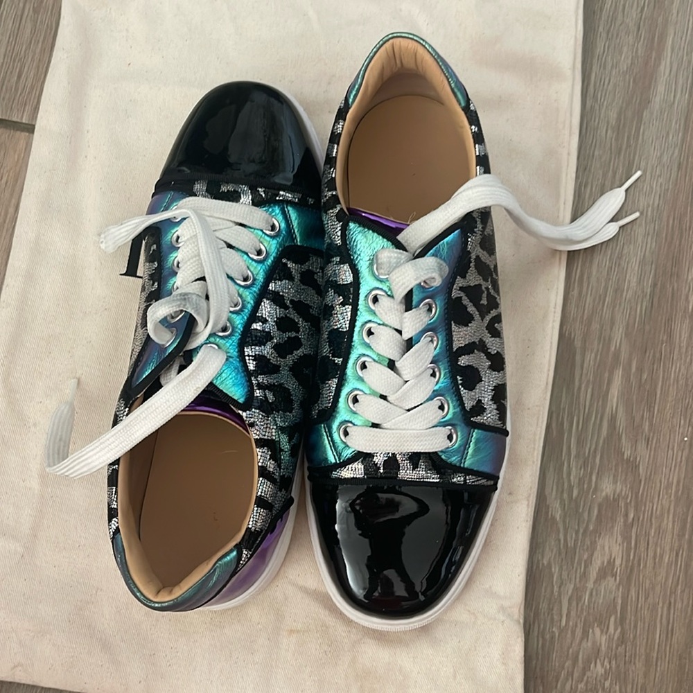 Black & Purple Women's Sneakers
made in Paris by Christian LOUBOUTIN
Red bottom